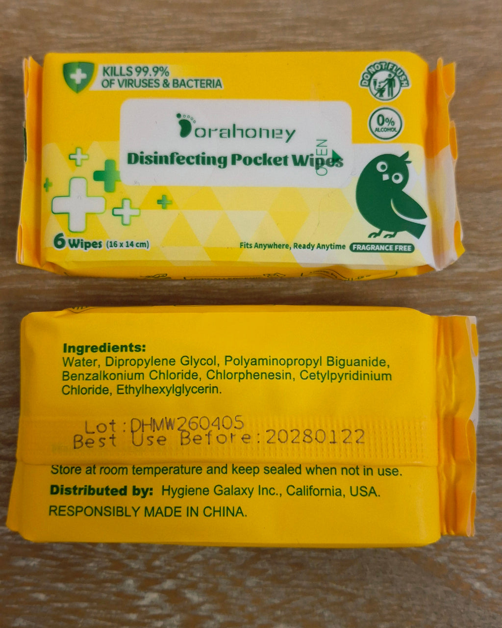 Two packs of handy hand wipes with one packet showing their ingredients.