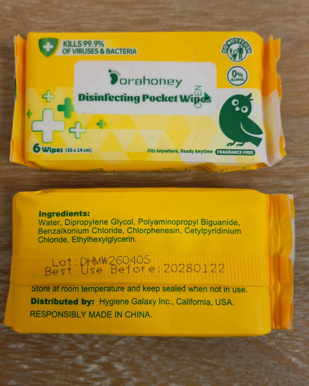Two packs of handy hand wipes with one packet showing their ingredients.