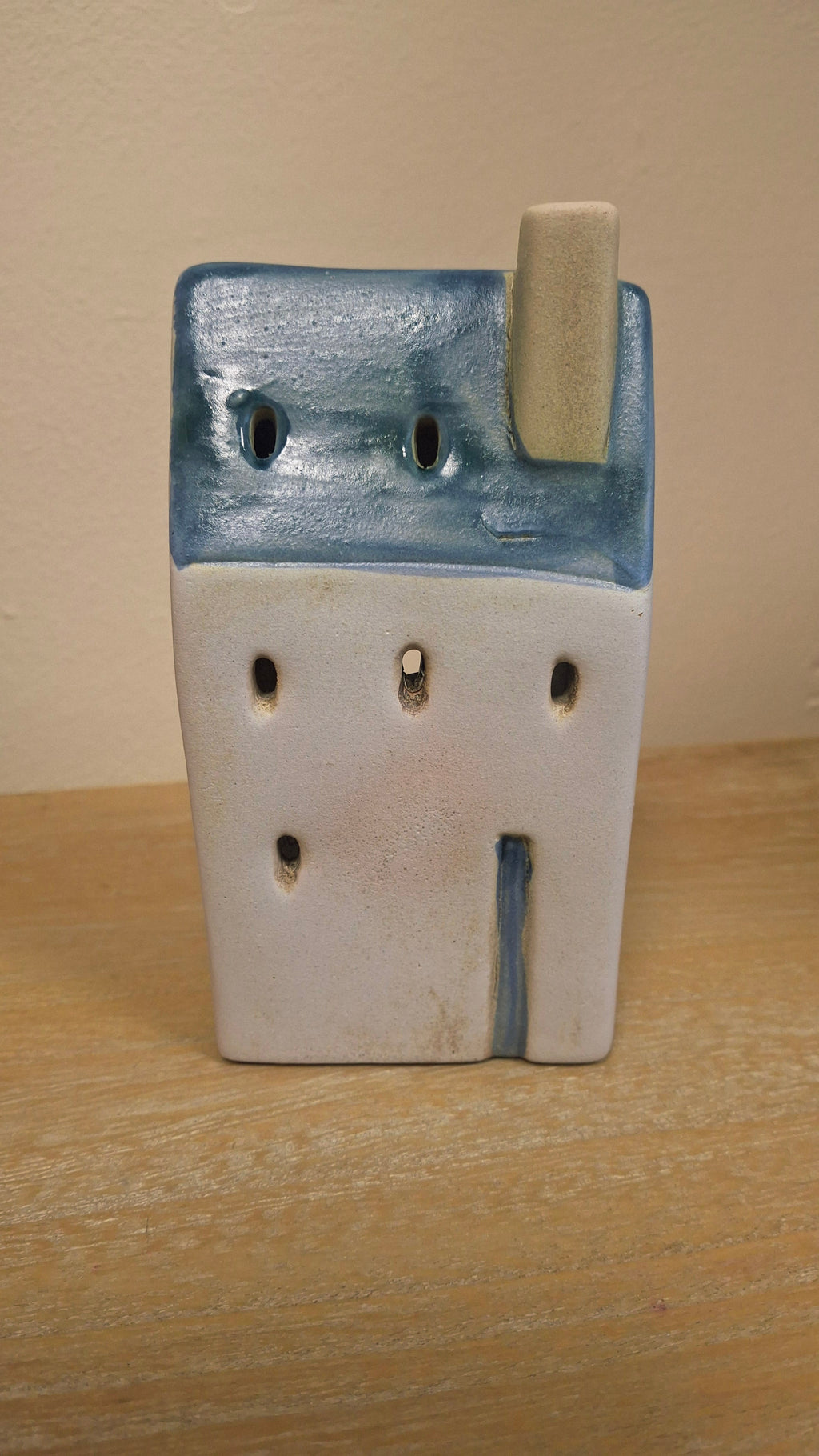 A close up of one of the coastal house tealight holders.