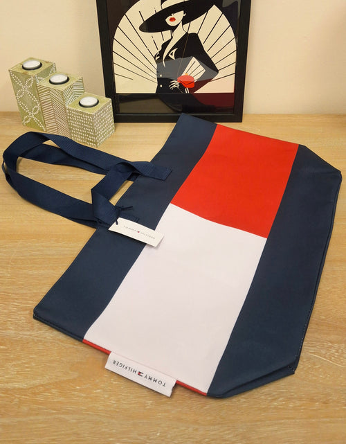 A Tommy Hilfiger fabric tote bag in navy blue, white and red. 
