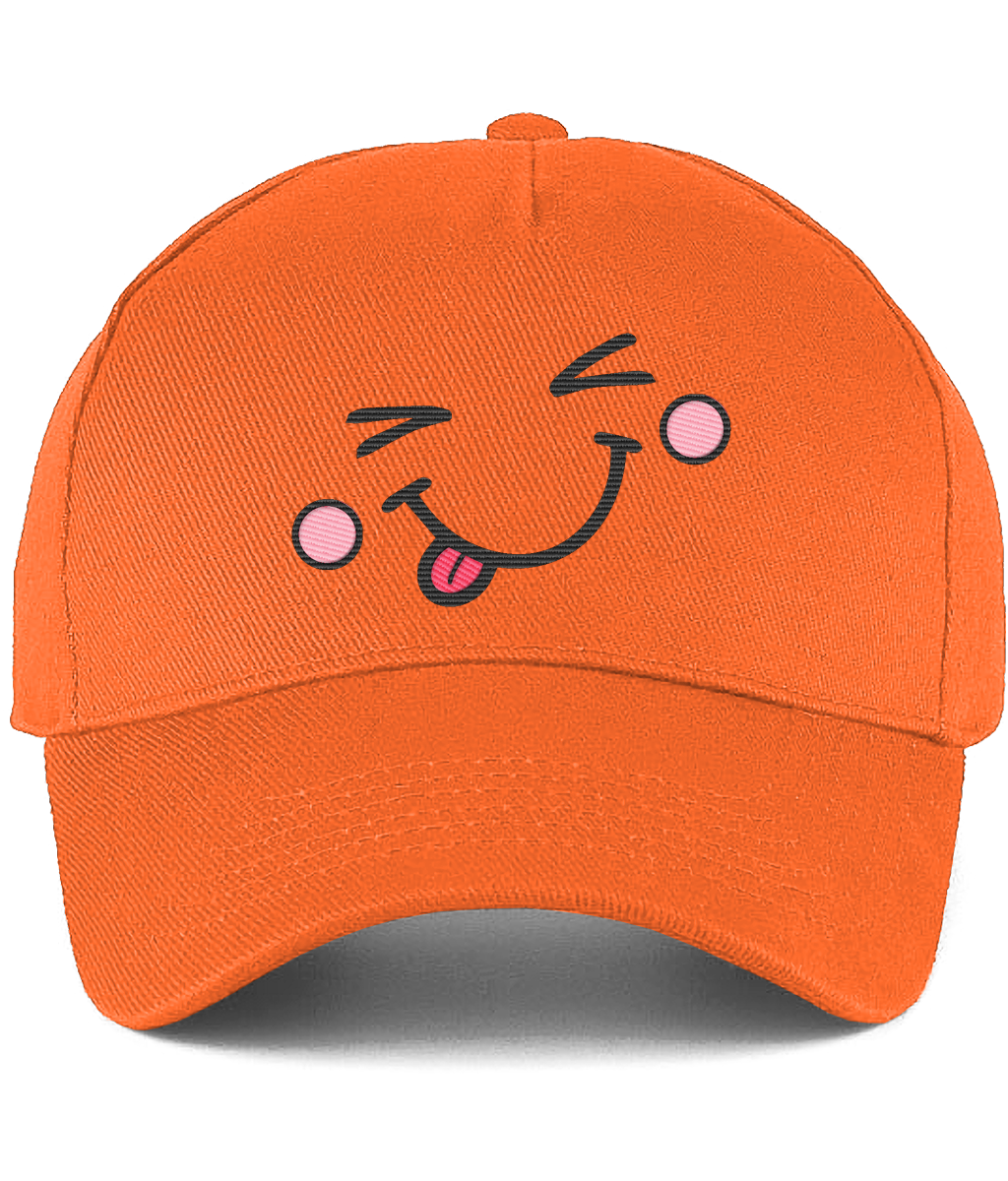 An orange baseball cap featuring a cartoon embroidered face on the front with winking eyes, pink cheeks, and a sticking-out tongue.
