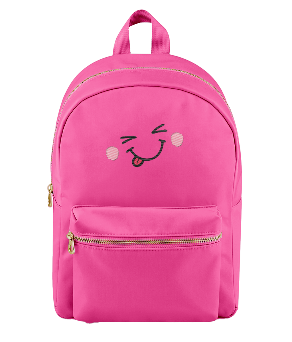 A bright pink nylon backpack with a front zippered pocket and an embroidered winking smiling face with pink cheeks on the front, shown against a plain white background.