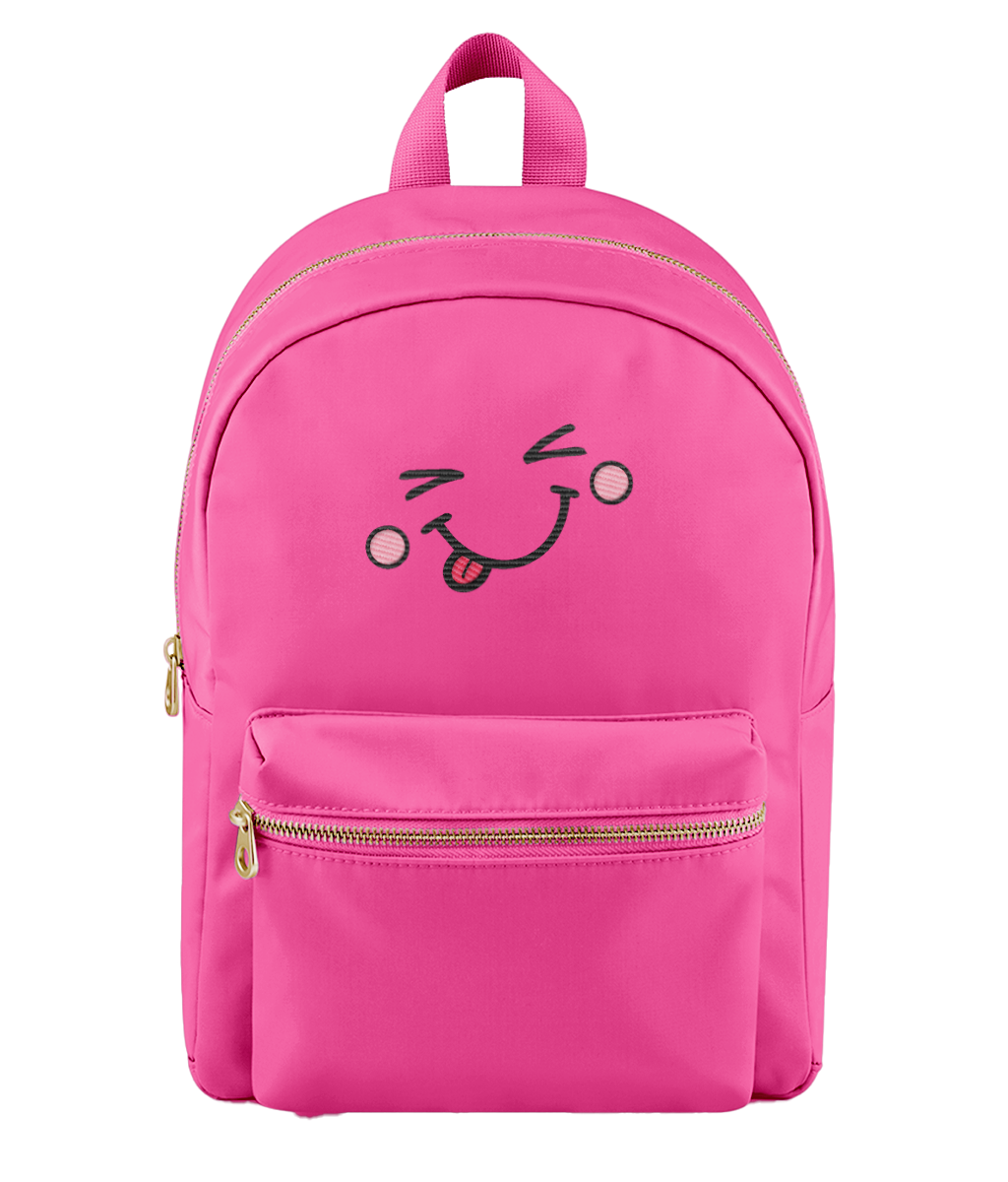 A bright pink nylon backpack with a front zippered pocket and an embroidered winking face with a sticking-out tongue on the front, shown against a plain white background.