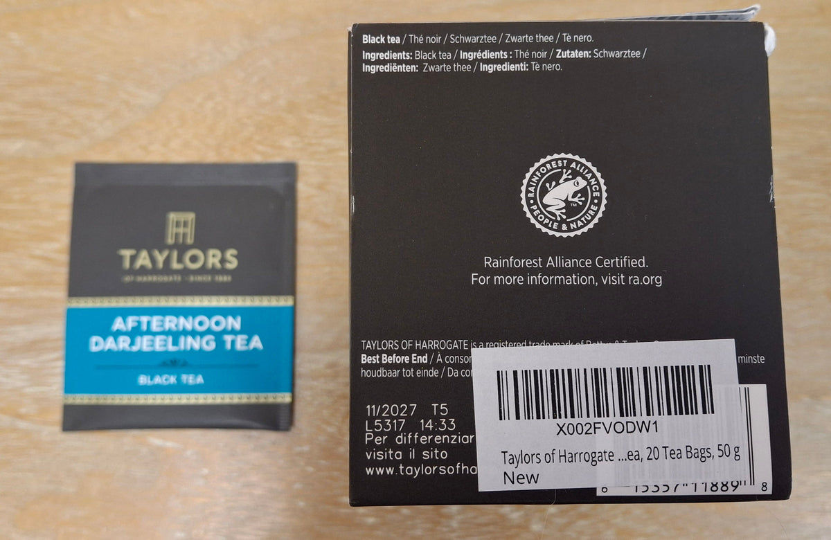 A close-up of a Taylor's Afternoon Darjeeling Tea box, showing the ingredients.